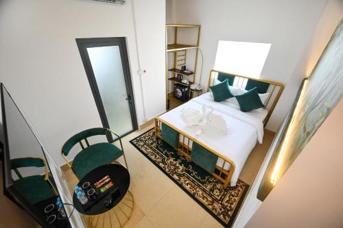 Postel nebo postele na pokoji v ubytování Hạnh Phúc Hotel