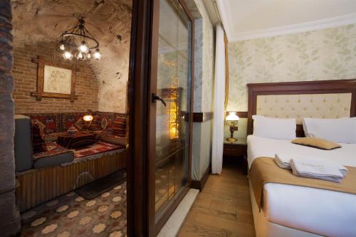 A bed or beds in a room at La Vida Old City Hotel