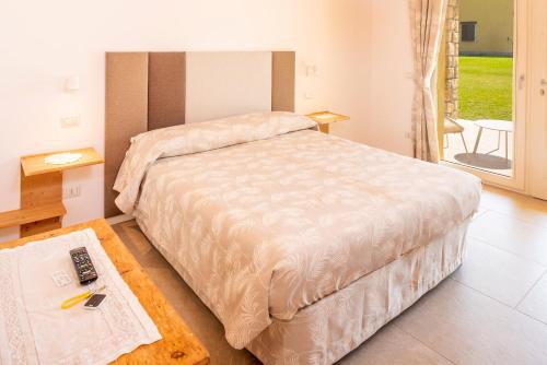 Una cama o camas en una habitación de Azienda Agricola Rovertondo