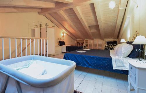 a large room with a tub and a bed at 3 Bedroom Stunning Apartment In Massa in Massa