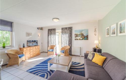 a living room with a couch and a table at Oesterbaai -5C1 in Wemeldinge