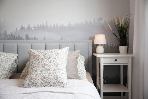 Postel nebo postele na pokoji v ubytování Apartamenty Deluxe