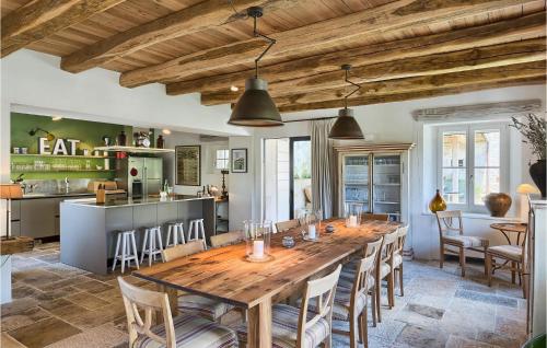 a large dining room with a wooden table and chairs at Villa Catalpa in Poreč