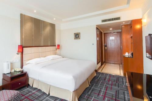 Ένα ή περισσότερα κρεβάτια σε δωμάτιο στο Header Baotou Hotel