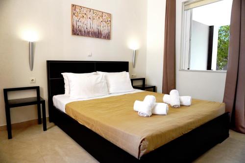 Ένα ή περισσότερα κρεβάτια σε δωμάτιο στο Artdeco Luxury Suites