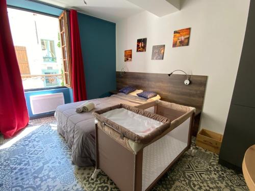 a bedroom with a bed with a tub in it at La Belle vigne - Chablis Centre in Chablis