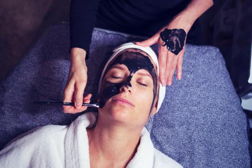 a woman getting her hair done at a salon at Hotell Mossbylund in Abbekås