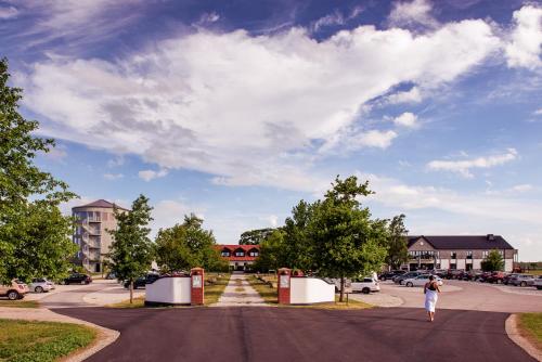 a person is walking down a street at Hotell Mossbylund in Abbekås