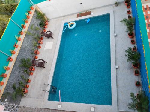 an overhead view of a swimming pool at a resort at villaa eden in Puducherry