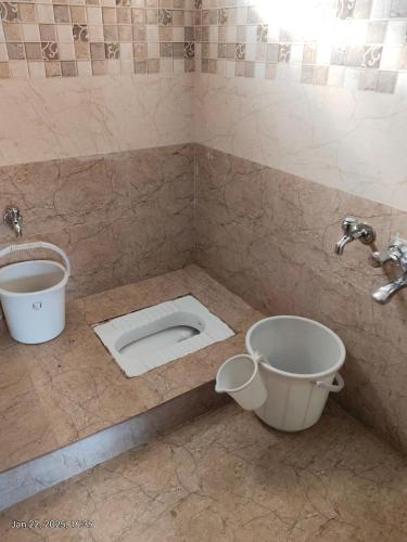 a bathroom with a toilet and a sink at villaa eden in Puducherry