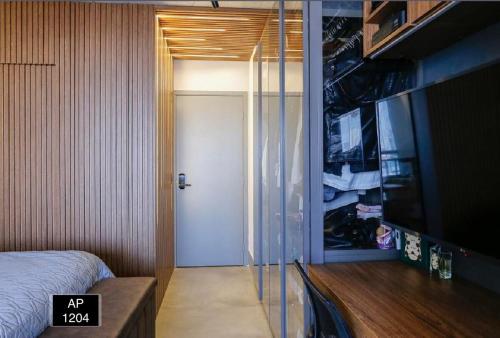 Ένα ή περισσότερα κρεβάτια σε δωμάτιο στο Studio 1204 Com Vista Livre e Andar Alto