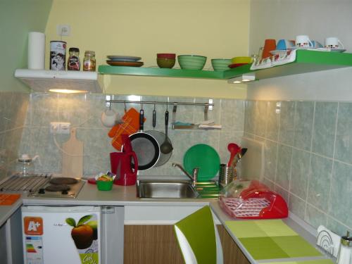 a kitchen with a sink and a counter top at Apartments - Penzion Lena in Hradec Králové