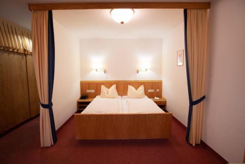 Ένα ή περισσότερα κρεβάτια σε δωμάτιο στο Appartement Hotel Finkenhof
