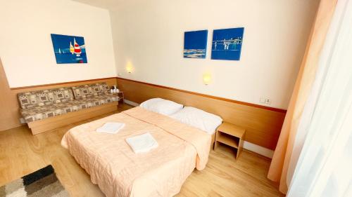 a hotel room with two beds in a room at Penzión na Sihoti in Trenčín