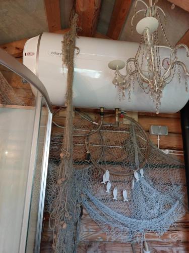 a gas tank hanging from the ceiling of a boat at Ohessaare mereäärne camping in Ohessaare