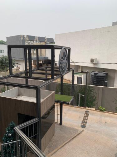 a building with a clock on the side of it at The City Landing Apartments At The Diamond in City in Accra