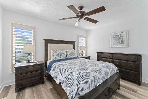 a bedroom with a bed and a ceiling fan at Beachfront 3-Bed I Location! Stunning Sunsets in Clearwater Beach