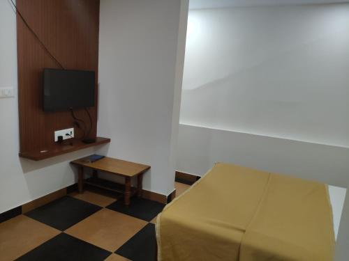 TV a/nebo společenská místnost v ubytování Nandan Residency