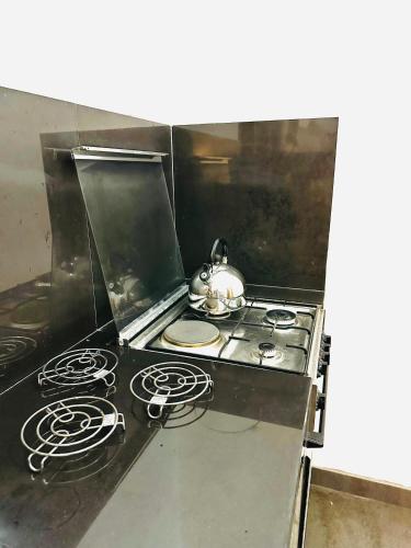 Η κουζίνα ή μικρή κουζίνα στο Paradise cove Apartment