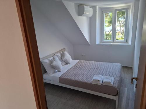 Katil atau katil-katil dalam bilik di Seaside Loft