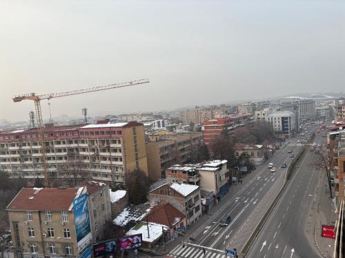 an overhead view of a city with a crane at CENTRAL ROOMS WITH GREAT VIEW shared bathroom no parking in Skopje