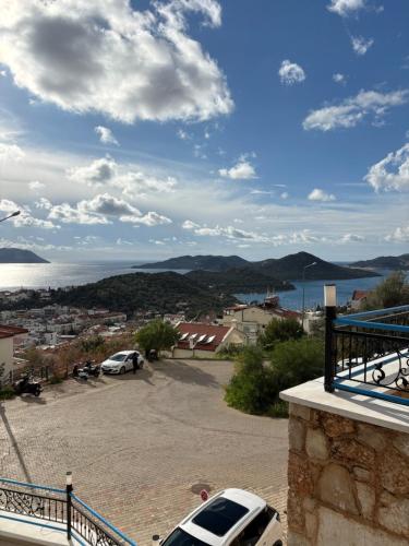 a view of a parking lot with a view of the water at Carpediem Apart in Kas