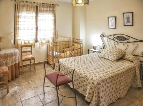 En eller flere senge i et værelse på Comfortable house in Sotoserrano with mountain view