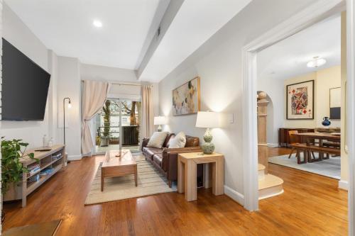a living room with a couch and a table at Spacious and Central DC 3-BR Getaway Close to It All in Washington, D.C.