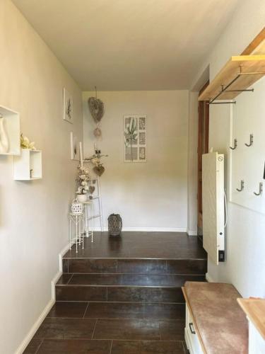 a staircase in a kitchen with a refrigerator at Nicole in Quedlinburg