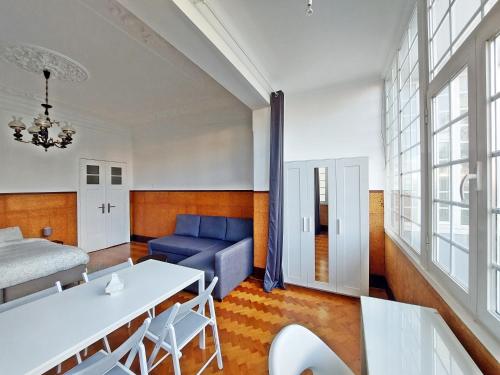 a living room with a couch and a table at Don Alvares in Lisbon