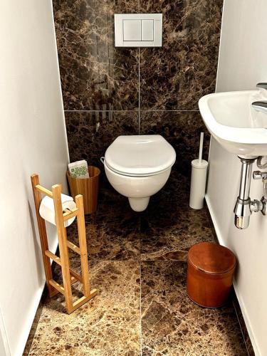 a bathroom with a toilet and a sink at Tempor'area Apartment in Antwerp