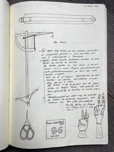 a page of a book with a drawing of a cross at Tempor'area Apartment in Antwerp