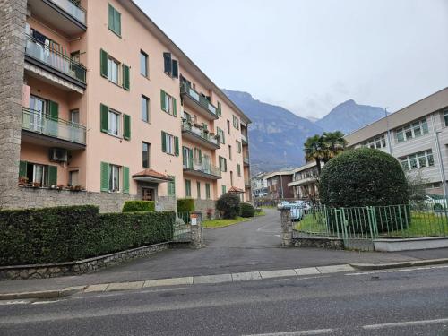 an empty street in a city with buildings at Business House in Costa Volpino