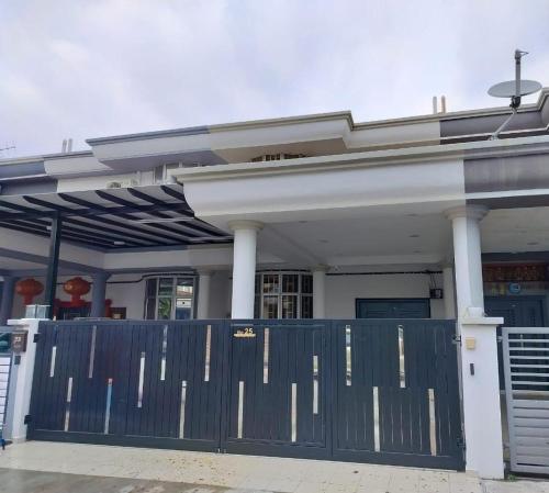 a blue gate in front of a building at KLANG - Enjoy Life Klang Homestay in Klang