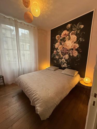 Una cama o camas en una habitación de Gîte Le Saint Père