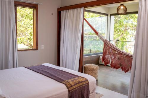 Ένα ή περισσότερα κρεβάτια σε δωμάτιο στο Vila Monã Jericoacoara