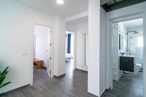 a white bathroom with a sink and a toilet at Villa Mauri Private Pool by Casasol in Nerja