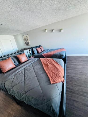 a bed with pillows on it in a room at Amazing Universal Studios Loft FREE parking in Los Angeles