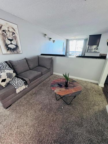 a living room with a couch and a table at Amazing Universal Studios Loft FREE parking in Los Angeles