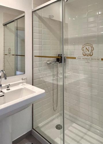 a bathroom with a shower and a sink at Noble House Essence Évora - by Unlock Hotels in Évora