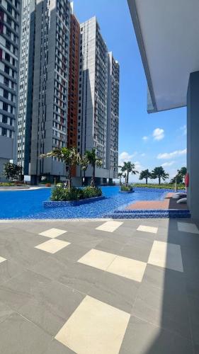 a view of a pool in a city with tall buildings at cozy space cinema suite at Trio By Setia in Klang
