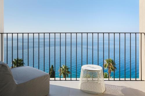 a balcony with a view of the ocean at Bluesun Hotel Jadran in Tučepi