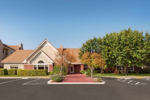 a house with a parking lot in front of it at Residence Inn San Jose South/Morgan Hill in Morgan Hill