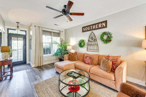 a living room with a couch and a table at 1 Mi to Old Town Cheerful Bluffton Townhome! in Bluffton