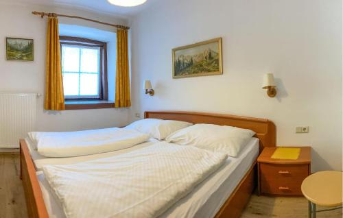 A bed or beds in a room at Ferienwohnung In Rauris