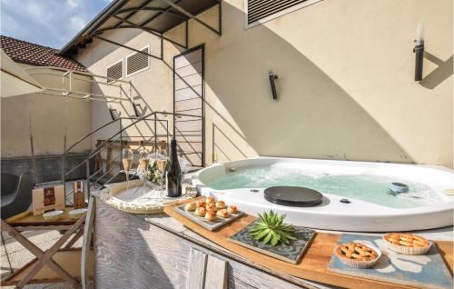 a jacuzzi tub in the middle of a building at Nice Apartment In Santo Stefano Belbo in Santo Stefano Belbo