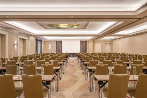 an empty banquet hall with tables and chairs at Munich Marriott Hotel in Munich
