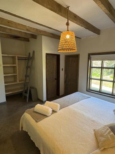 Ein Bett oder Betten in einem Zimmer der Unterkunft Casona el Refugio Casablanca