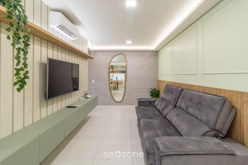 Televisyen dan/atau pusat hiburan di MCB - Apartamentos com piscina prox. da Praia