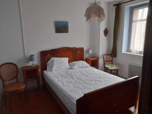 Postel nebo postele na pokoji v ubytování la tute de l'ours